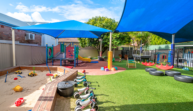 A sandpit and a vegetable garden